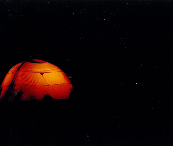 A glowing tent on the upper slopes of Kili