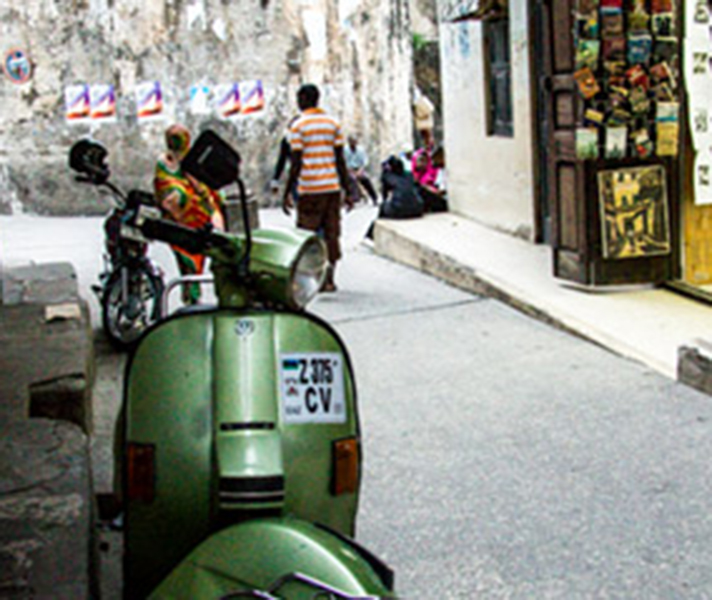 A classic street scene in Stone Town's narrow alleyways.