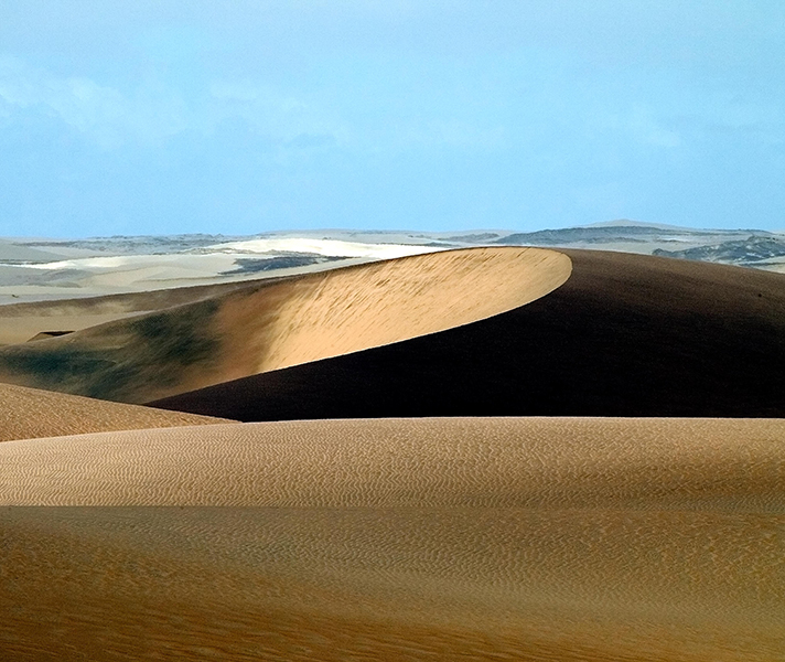 Lines provide an obvious visual cue pointing to what is important in an image, just like the shadows created on this sand dune in Namibia.