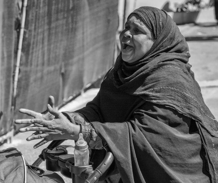 ‘This mother was engaged in earnest conversation with one of the street vendors – I’d seen her there before and was attracted by her simultaneously impassioned and restrained pleas.’