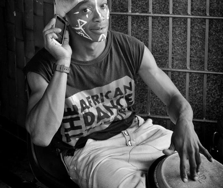 ‘This guy was drumming up a storm to advertise the African Dance Theatre then he stopped to take a call. “Beautiful,” I said as I walked away. “The old and the new,” he said, pointing at the drums and his cellphone. Smart guy.’