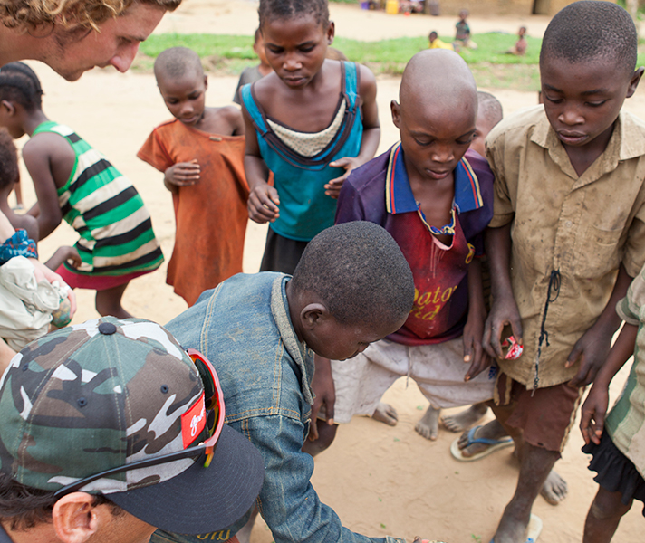 Brett & Terrence learn a new game played with sardine cans & flip-flops!
