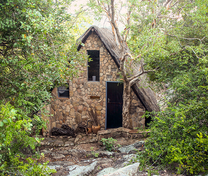 Traditional grain bins at Kalang & stone chalets at Big Cave Camp.