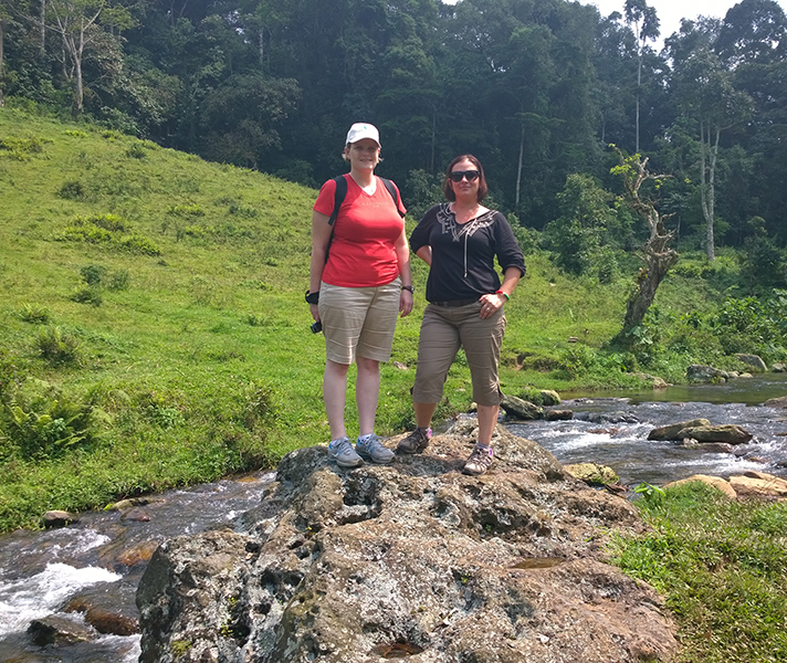 Safari Experts Anza and Ramona exploring the beautiful Bwindi rainforest.