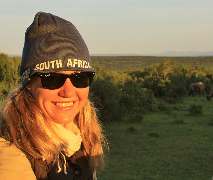 Go2African Angela spots a herd of buffalo on a dawn game drive.
