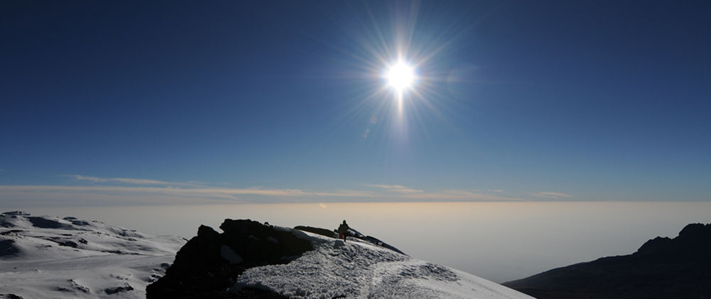 On top of the clouds: the sun is always shining at the summit because you're above the cloud line but the temperatures are still sub-zero!