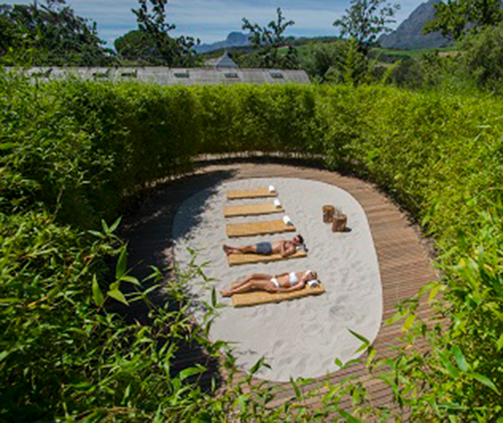 The 'beach' is a peaceful clearing of white sand in the tranquil bamboo garden, just steps from the swimming pool.