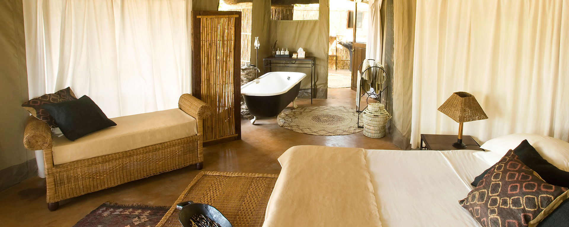 The spacious and luxurious tents at Mchenja Camp have en suite bathrooms that look out over the river.
