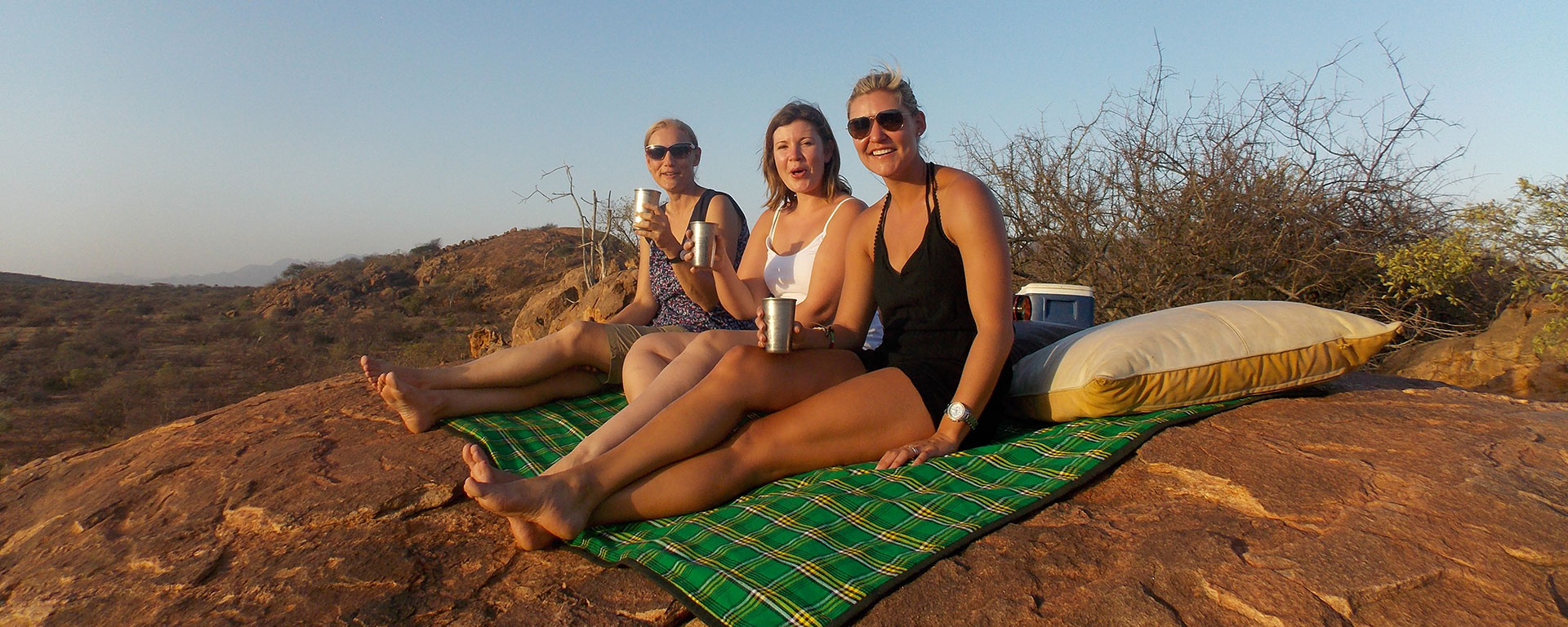 Go2African Safari Experts Anja, Mary and Ashley enjoying sundowners in Samburu Game Reserve.