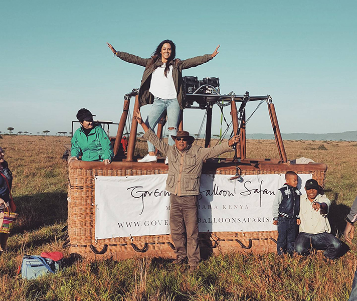 Feeling on top of the world after experiencing a beautiful sunrise and breath-taking views of the Masai Mara in a hot-air balloon.