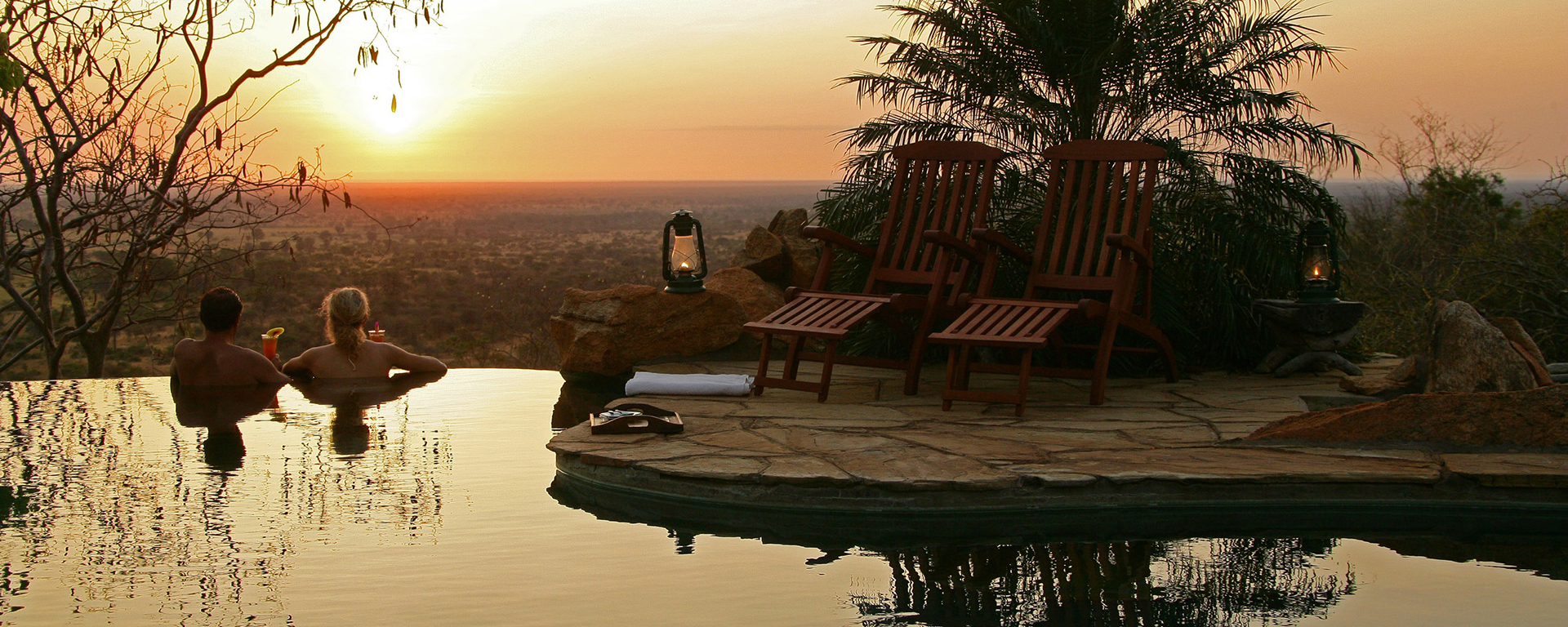 A sunset toast overlooking the Meru plains at Elsa's Kopje.