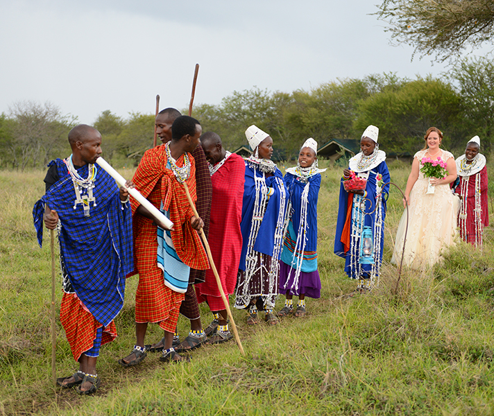 Beaming bride-to-be Jen is led down the aisle at Asanja Africa Camp!
