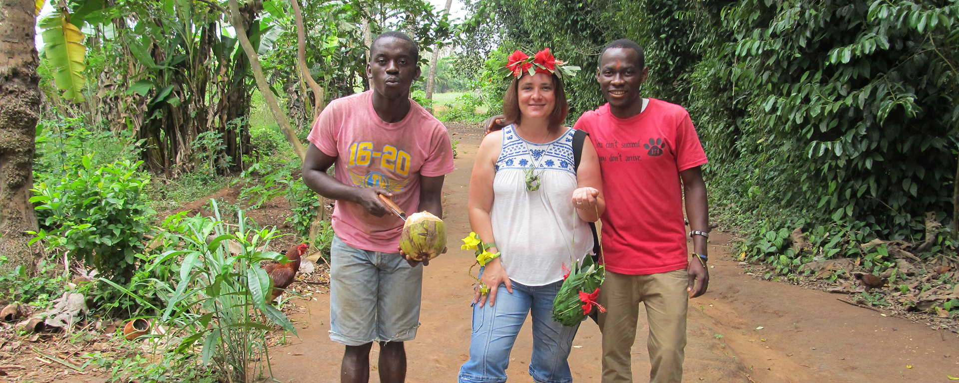 Go2Africa Safari Expert Anza shows off her 'jewellery' and 'handbag', crafted from indigenous flowers and plants by her talented guides on a Zanzibar spice tour.