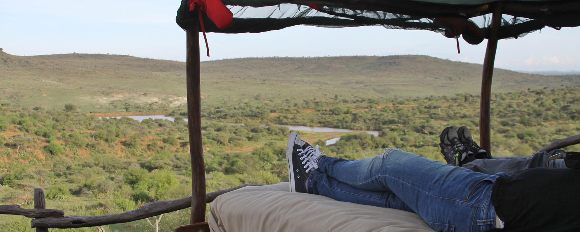 Go2Africans Tracy and Rikke ‘test drive’ a starbed and take in the river view at Loisaba.