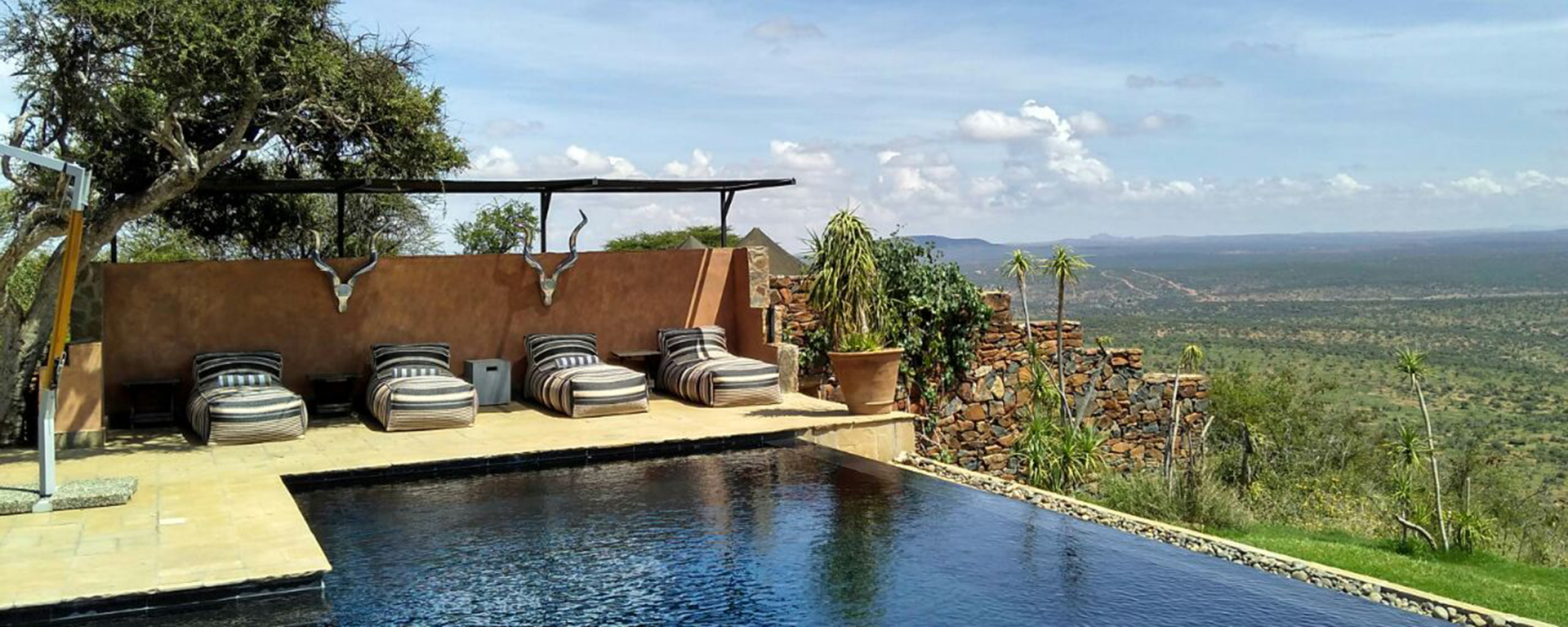 Swim ‘on top of the world’ at Loisaba. The pool is black to absorb the sun and take the chill off the water.