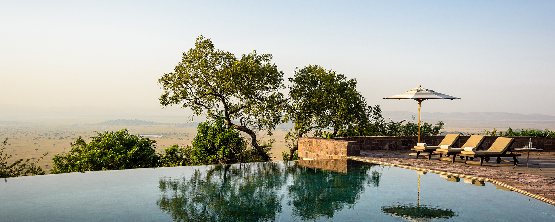 Singita Sasakwa Lodge is located in the private Grumeti Game Reserve (bordering the Serengeti), offering access to the Grumeti Crossings that happen toward the end of June.