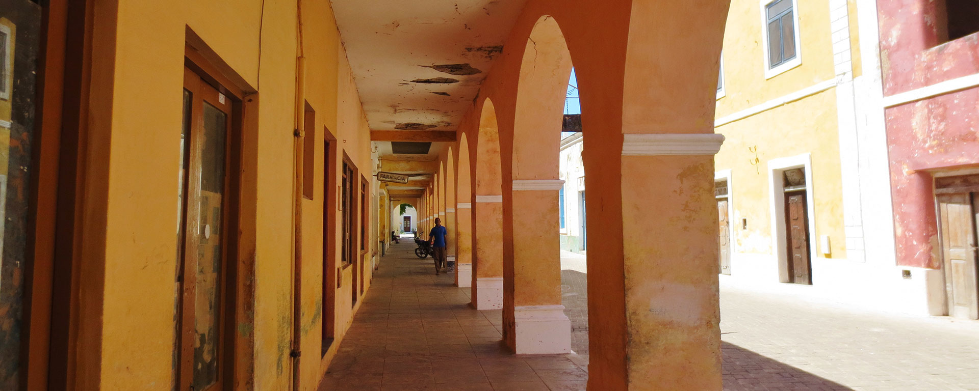 The old architecture was designed with the climate in mind: think thick walls and long, deep, shady verandas. The paint has faded to the colour of sorbet.