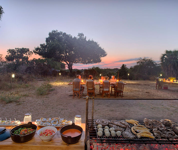 Dinner was often served outdoors under the stars and next to the boma, with a barbeque and lots of sides.