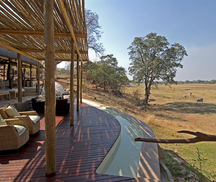Spot wildlife from Puku Ridge's open-fronted lounge, overlooking the rich grasslands of the Kakumbi Floodplain.
