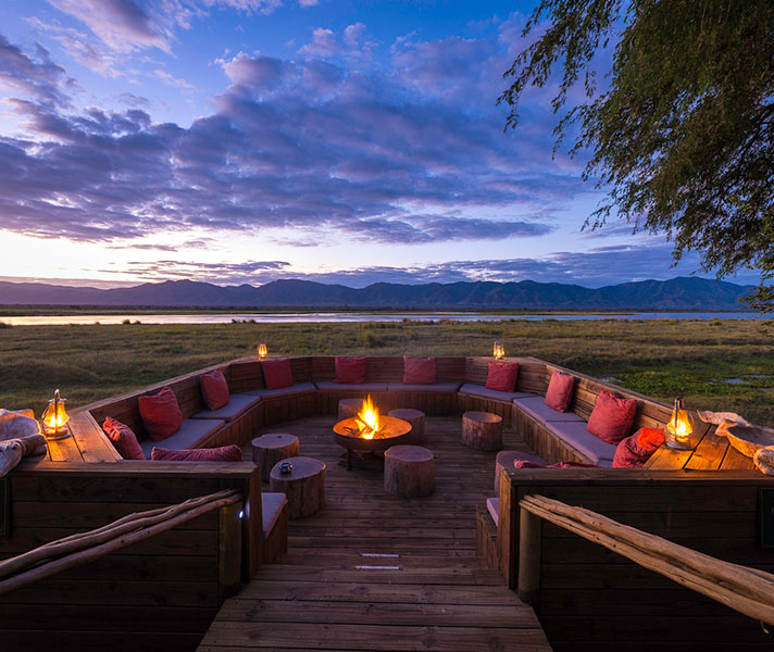 Ruckomechi's tucked in a large grove of acacia and mahogany trees on the banks of the hippo-filled Zambezi River.