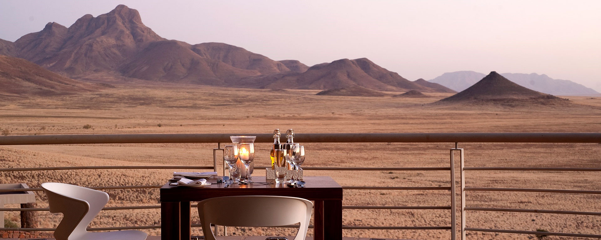 A romantic dinner overlooking the shifting sands and rocky outcrops of the world's oldest desert, the Namib.
