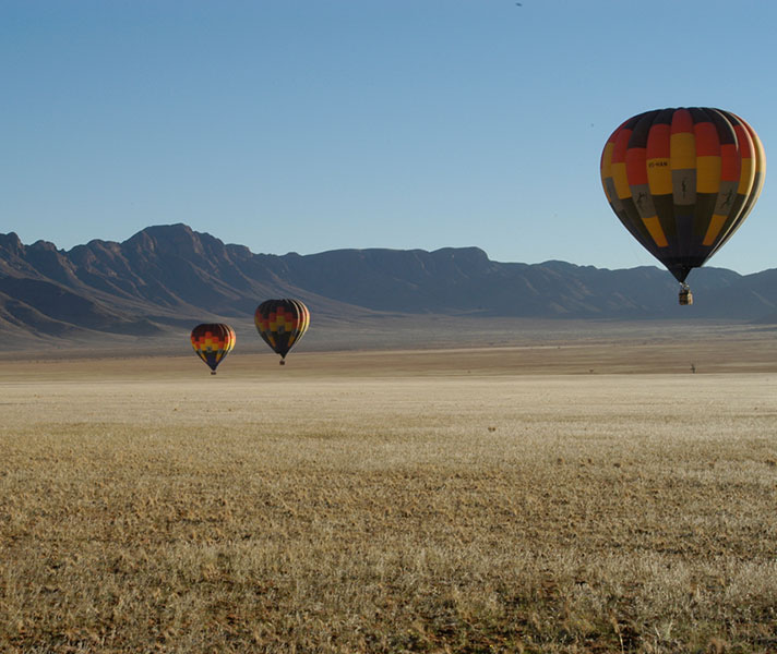 Climb into the basket of a hot-air balloon and enjoy a bird's eye view of the Namib Desert.