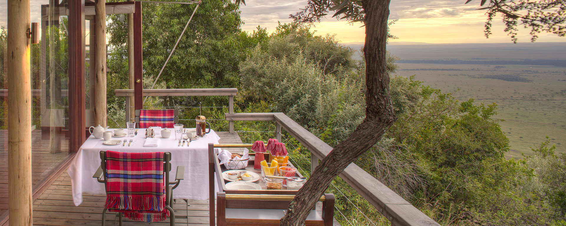 At Angama Mara, your private viewing deck has expansive views of the wide-open Mara plains below.