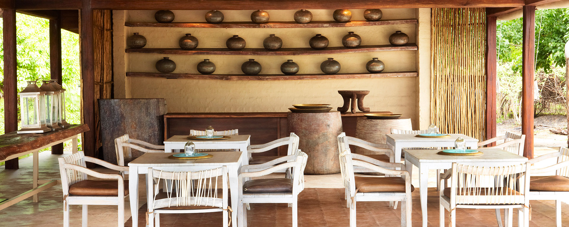 The airy dining area at Kings Pool Camp highlights Botswana’s rich history of simple but beautiful ceramics.